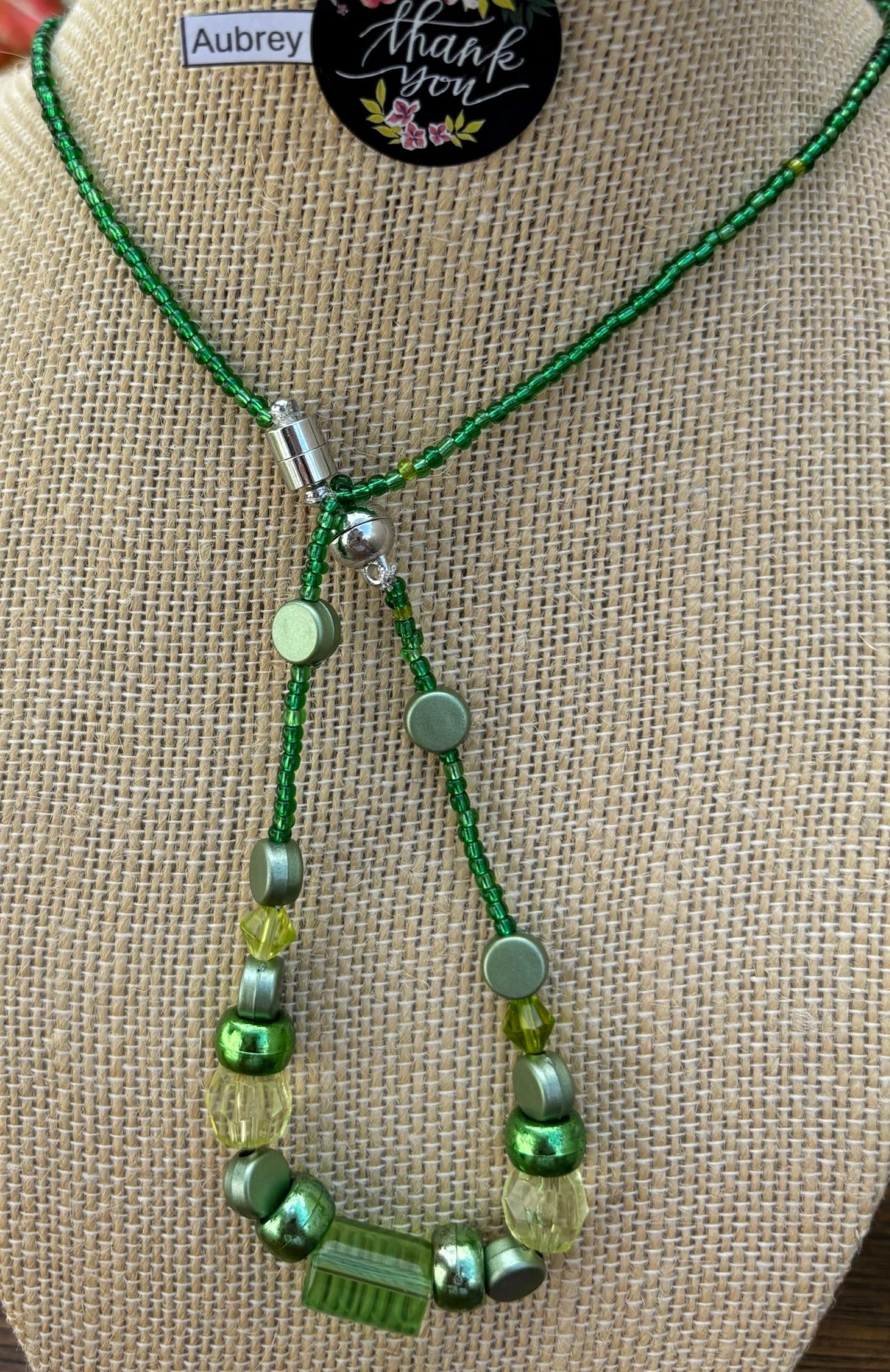 Aubrey - Emerald Elegance Stunning Green Beaded Necklace. Necklace showcases a beautiful array of greens, from deep forest to light lime.